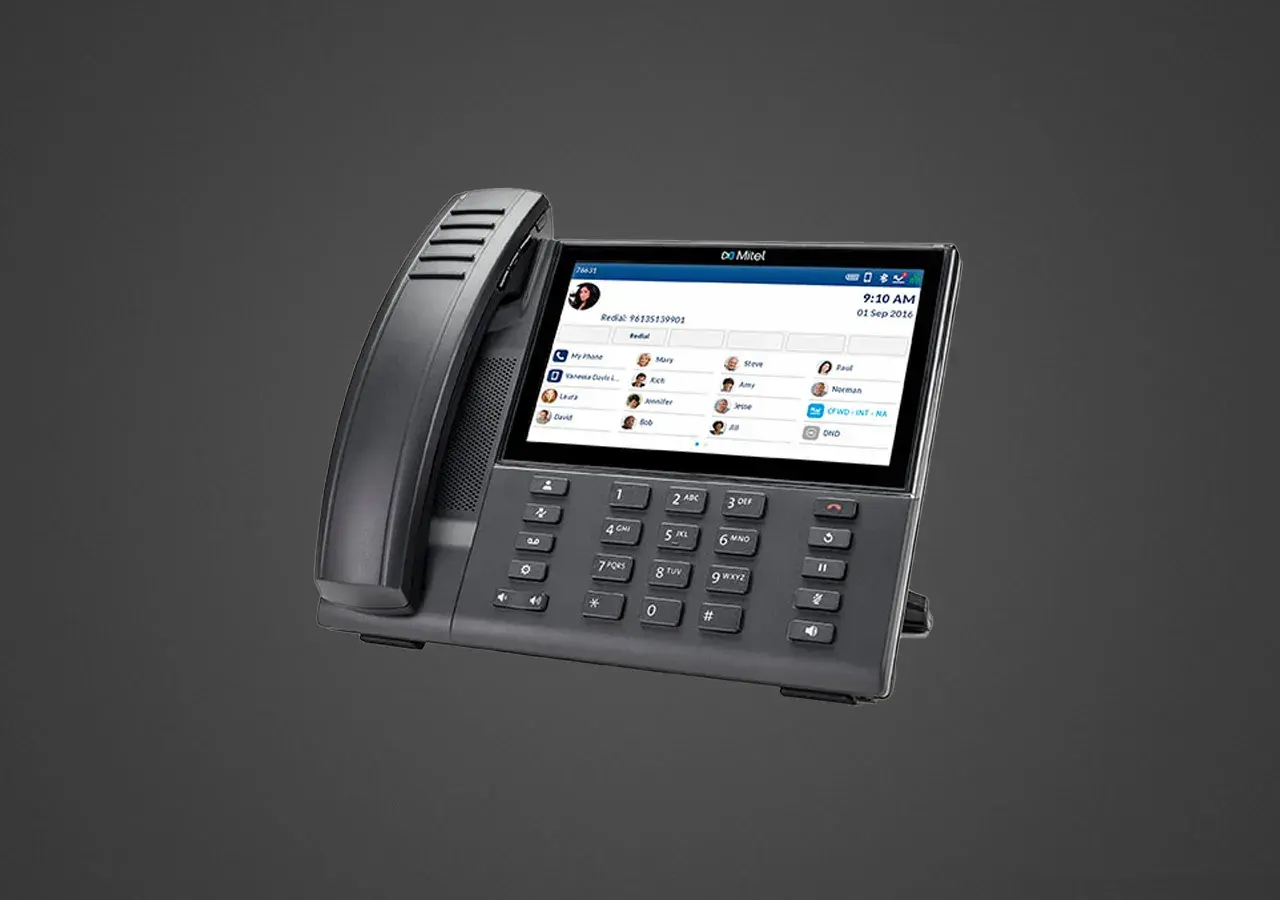 Mitel 6940 Handset with touchscreen interface, featured in Now NZ's tutorial series on advanced business communication features.