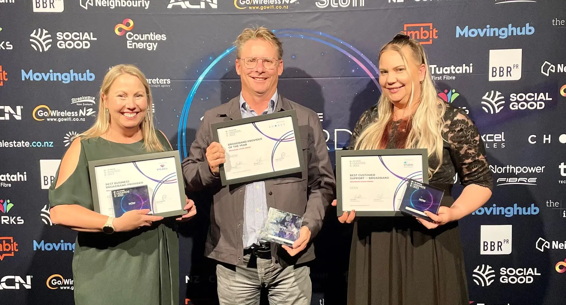 Now team members holding awards for Best Business Broadband Provider, Best Customer Support, and Broadband Provider of the Year at the 2023 NZ Compare Awards.