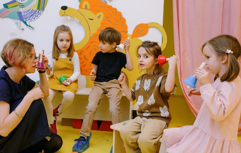 Teacher engaging with young children in a classroom, symbolising Now NZ's connectivity solutions that empower educators in the education and training sector.