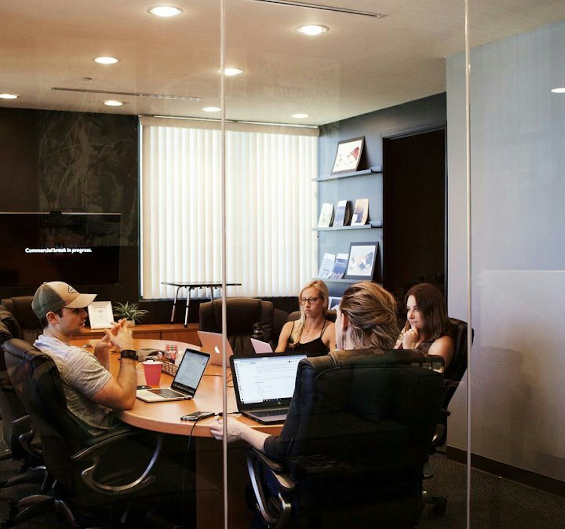 Business team in a conference room with laptops, reflecting the high-speed connectivity and robust reliability of Now NZ’s Premium Internet and managed network solutions for large businesses.